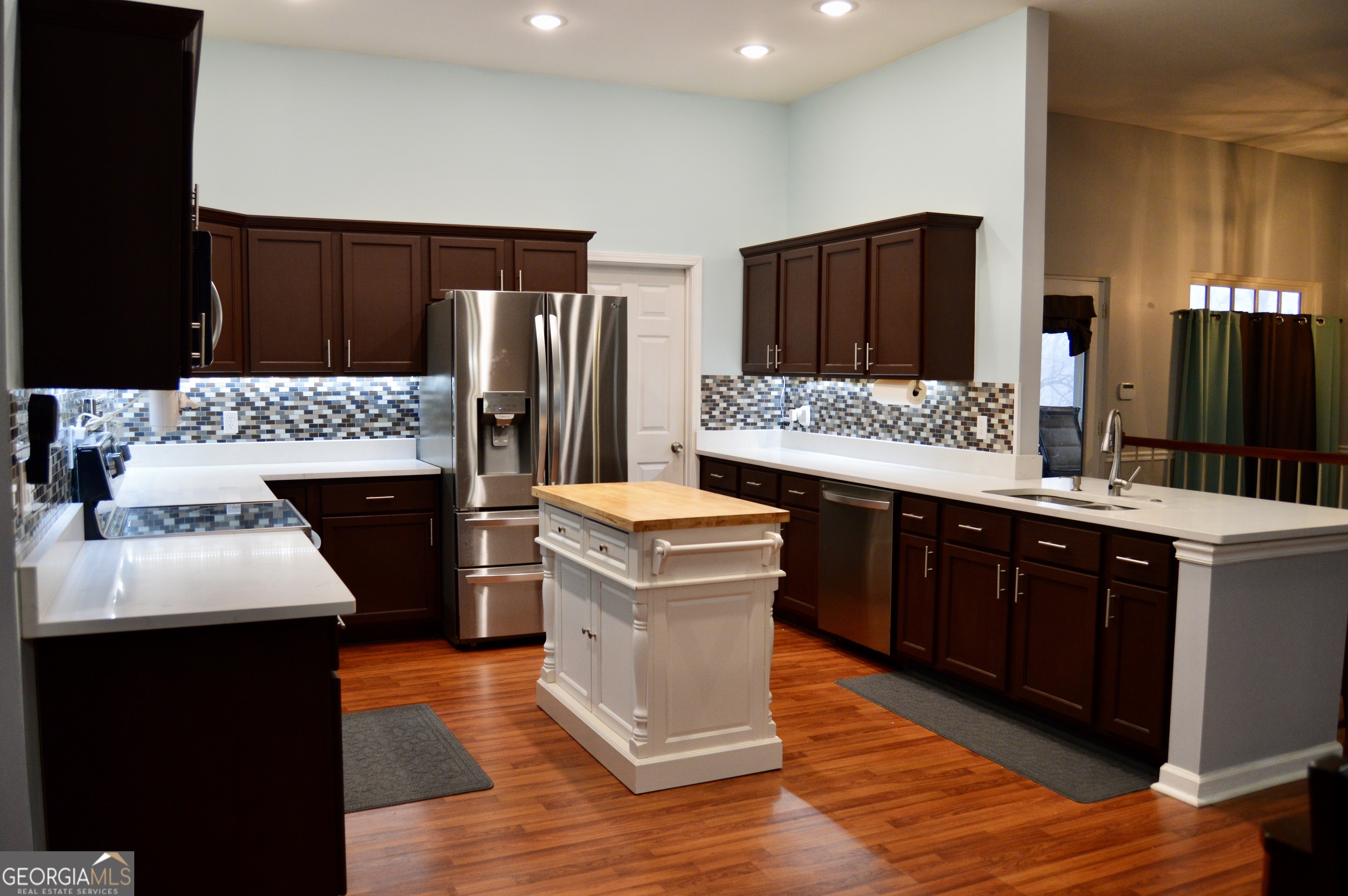 817 Brookside Drive Winder, GA 30680 - Photo 9 of 73 a kitchen with a sink and a refrigerator