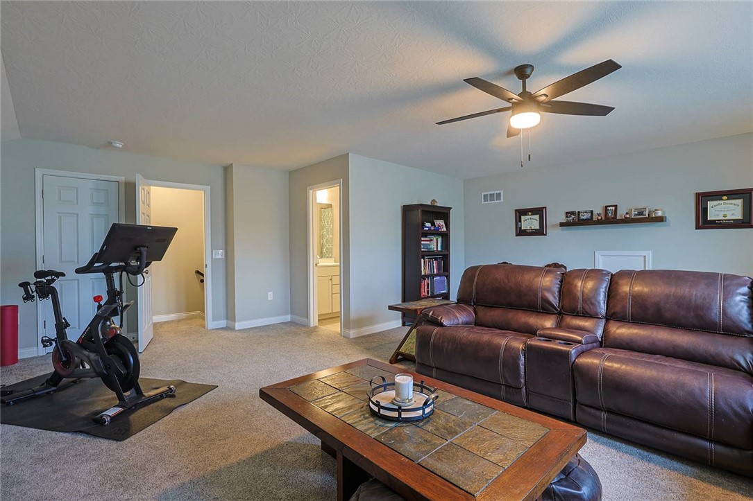 5013 Arena Court Hamilton, OH 45011 - Photo 38 of 41 This versatile bonus room offers comfortable lounging and a dedicated space for fitness pursuits.