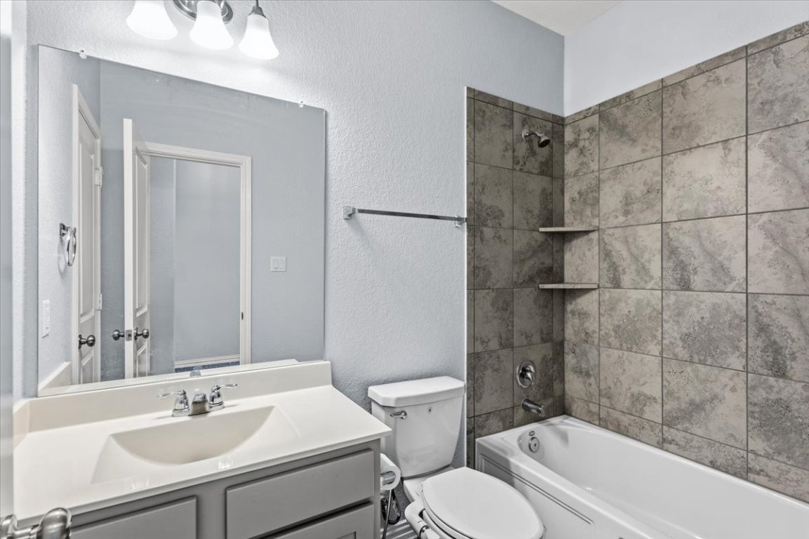 1440 Morning View Road Georgetown, TX 78628 - Photo 11 of 22 a bathroom with a sink toilet and shower