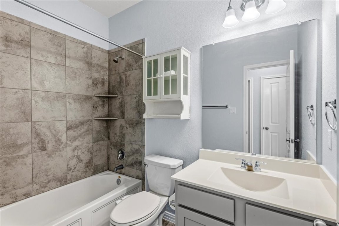 1440 Morning View Road Georgetown, TX 78628 - Photo 12 of 22 a bathroom with a sink toilet and shower