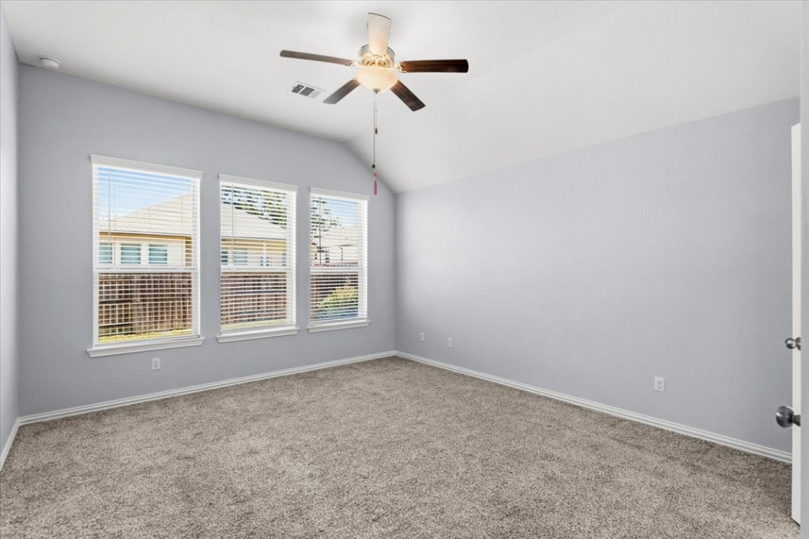1440 Morning View Road Georgetown, TX 78628 - Photo 15 of 22 an empty room with a window and a fan