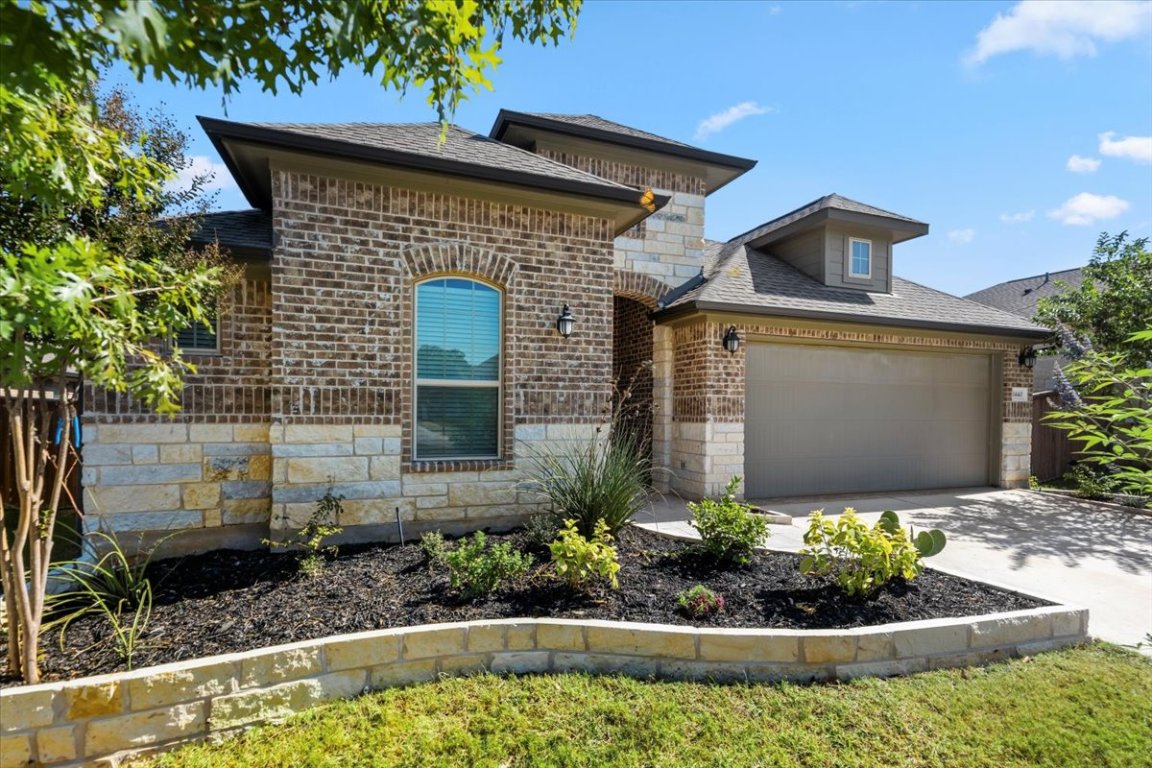 1440 Morning View Road Georgetown, TX 78628 - Photo 7 of 22 a front view of a house with a yard