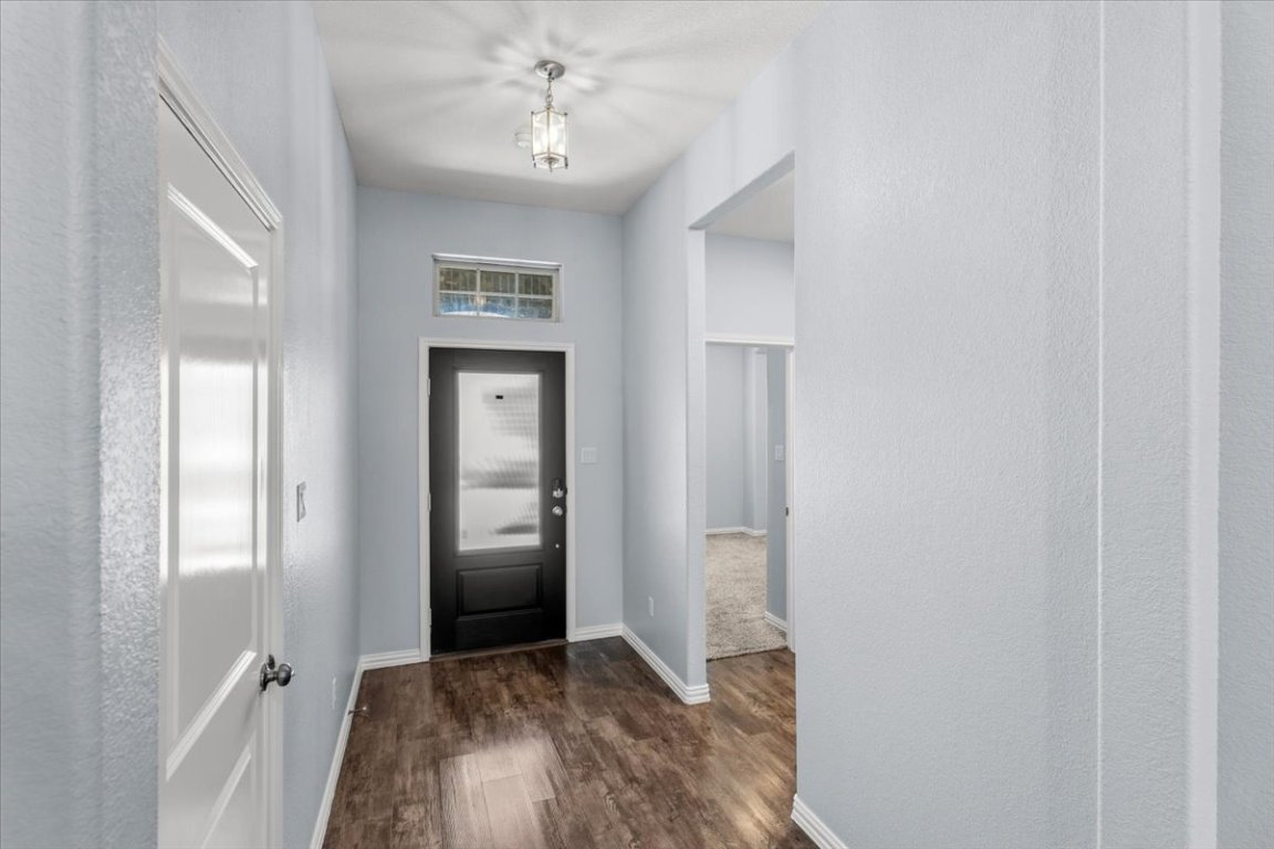 1440 Morning View Road Georgetown, TX 78628 - Photo 8 of 22 a view of livingroom with hardwood floor and hallway