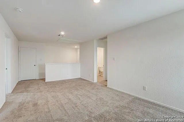 10707 Margarita Loop Converse, TX 78109 - Photo 20 of 32 Unfurnished room with light colored carpet