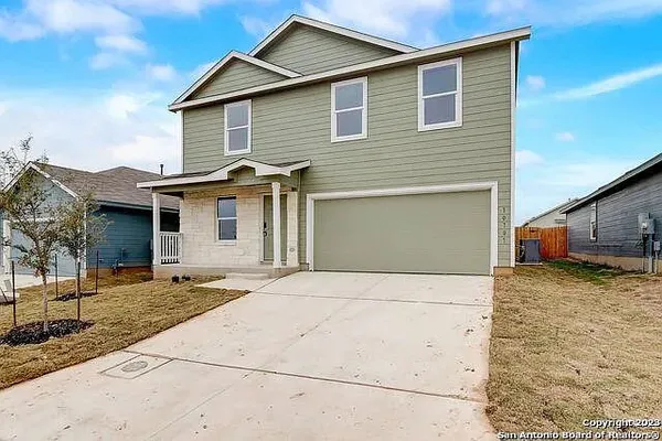 a front view of a house with garage