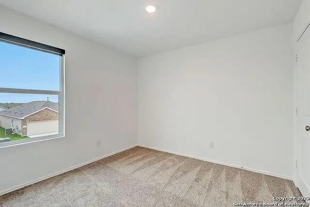 10707 Margarita Loop Converse, TX 78109 - Photo 25 of 32 Carpeted spare room featuring baseboards