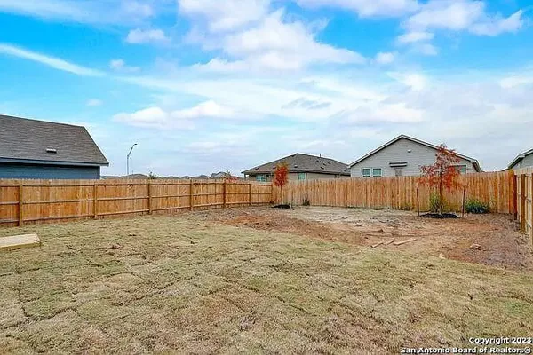 a view of a backyard of the house