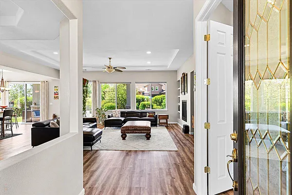 a living room with fireplace and a flat screen tv