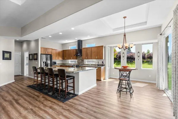 a kitchen with a sink stove and refrigerator
