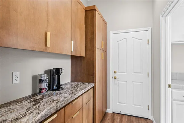 a bedroom with furniture and a window