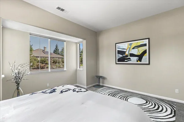 a view of a swimming pool with a yard