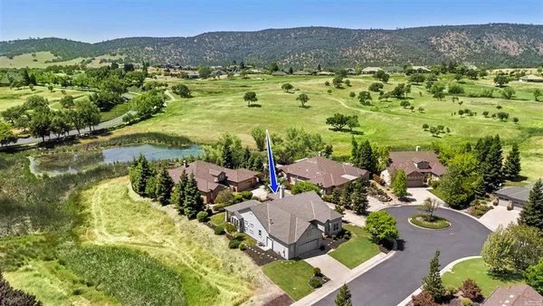 a view of a hallway view with wooden floor and furniture