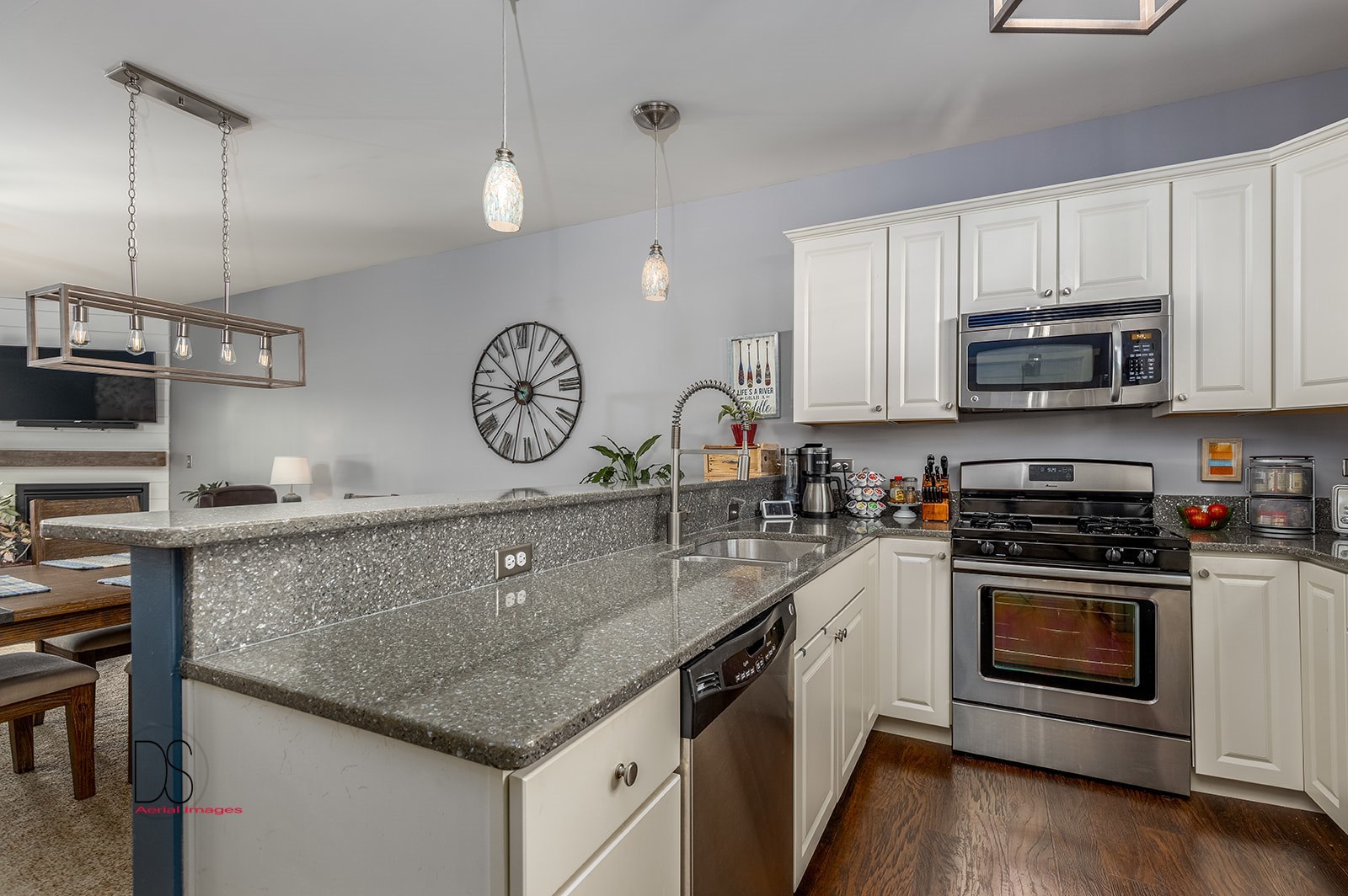 5 River Row Ottawa, IL 61350 - Photo 12 of 31 a kitchen with stainless steel appliances granite countertop a stove a sink and a microwave