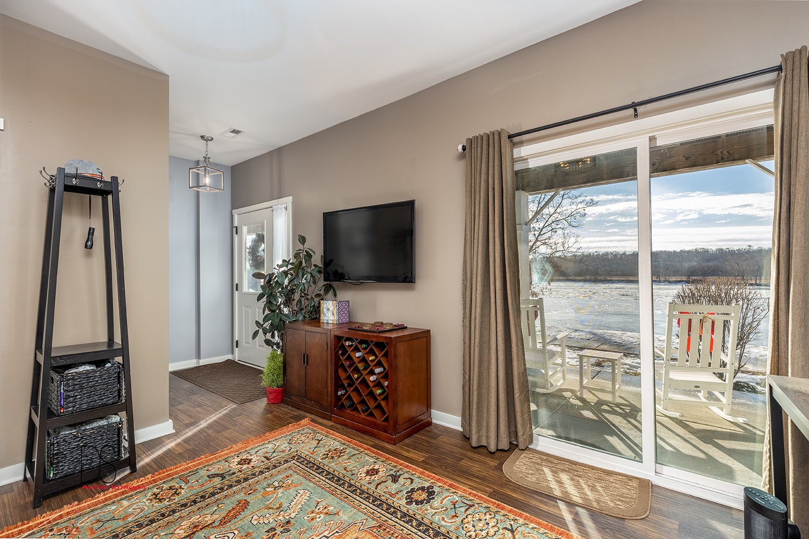 5 River Row Ottawa, IL 61350 - Photo 5 of 31 a living room with a flat screen tv and a floor to ceiling window