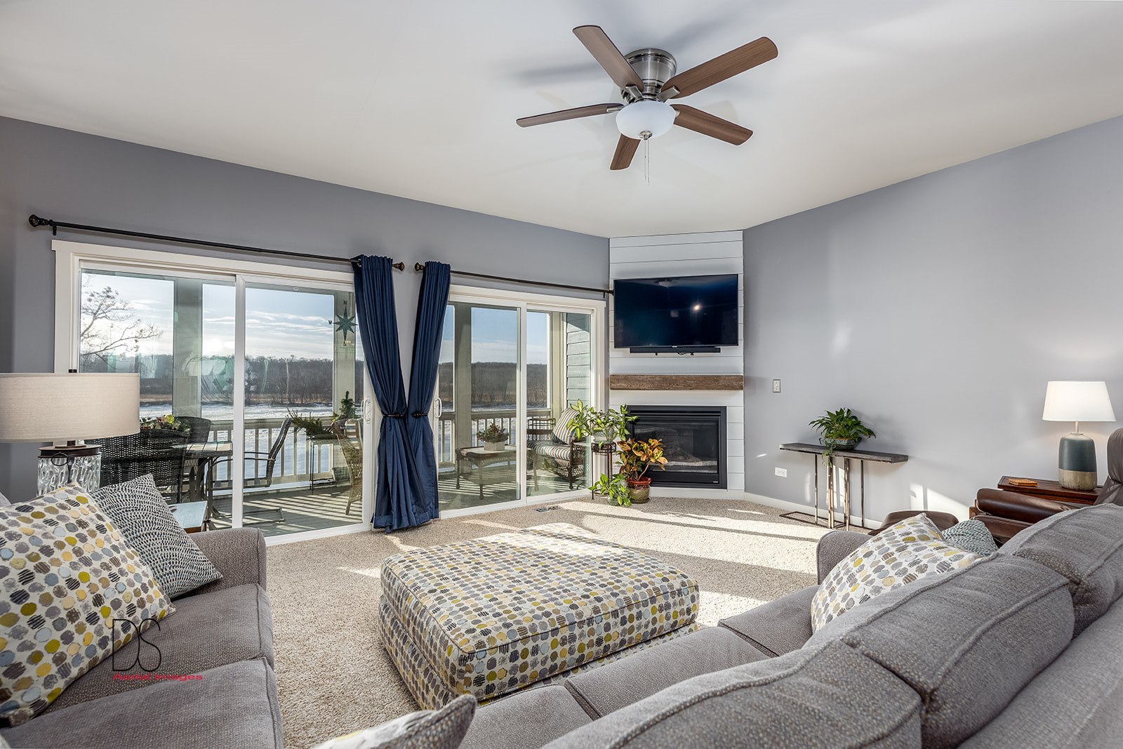 5 River Row Ottawa, IL 61350 - Photo 9 of 31 a living room with furniture a fireplace and a large window with outer view