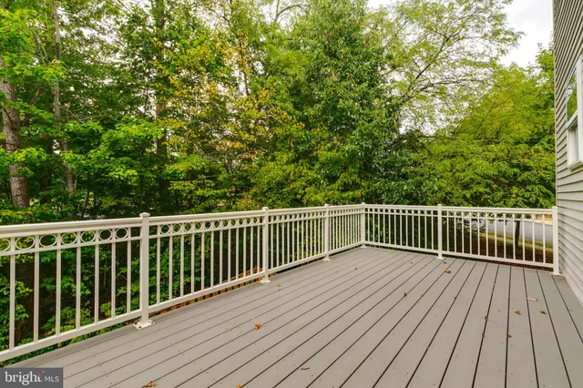 a balcony with trees in front of it