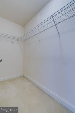 a view of a livingroom with a ceiling fan and window