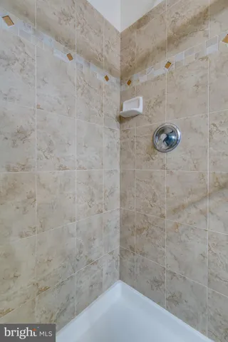 a bathroom with a tub and a window