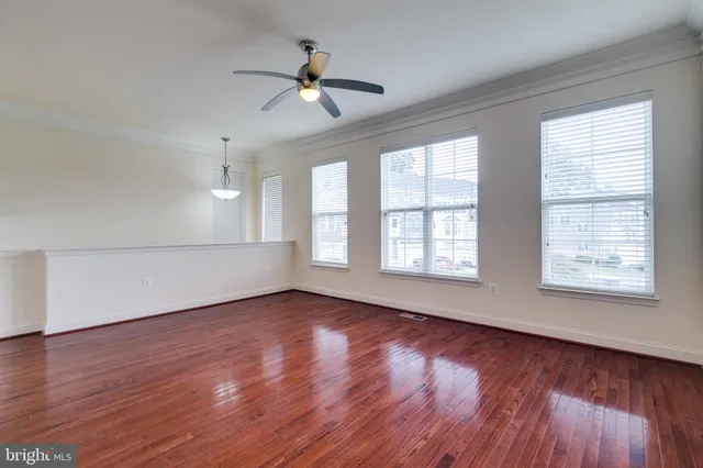a view of an entryway with wooden floor and a chandelier