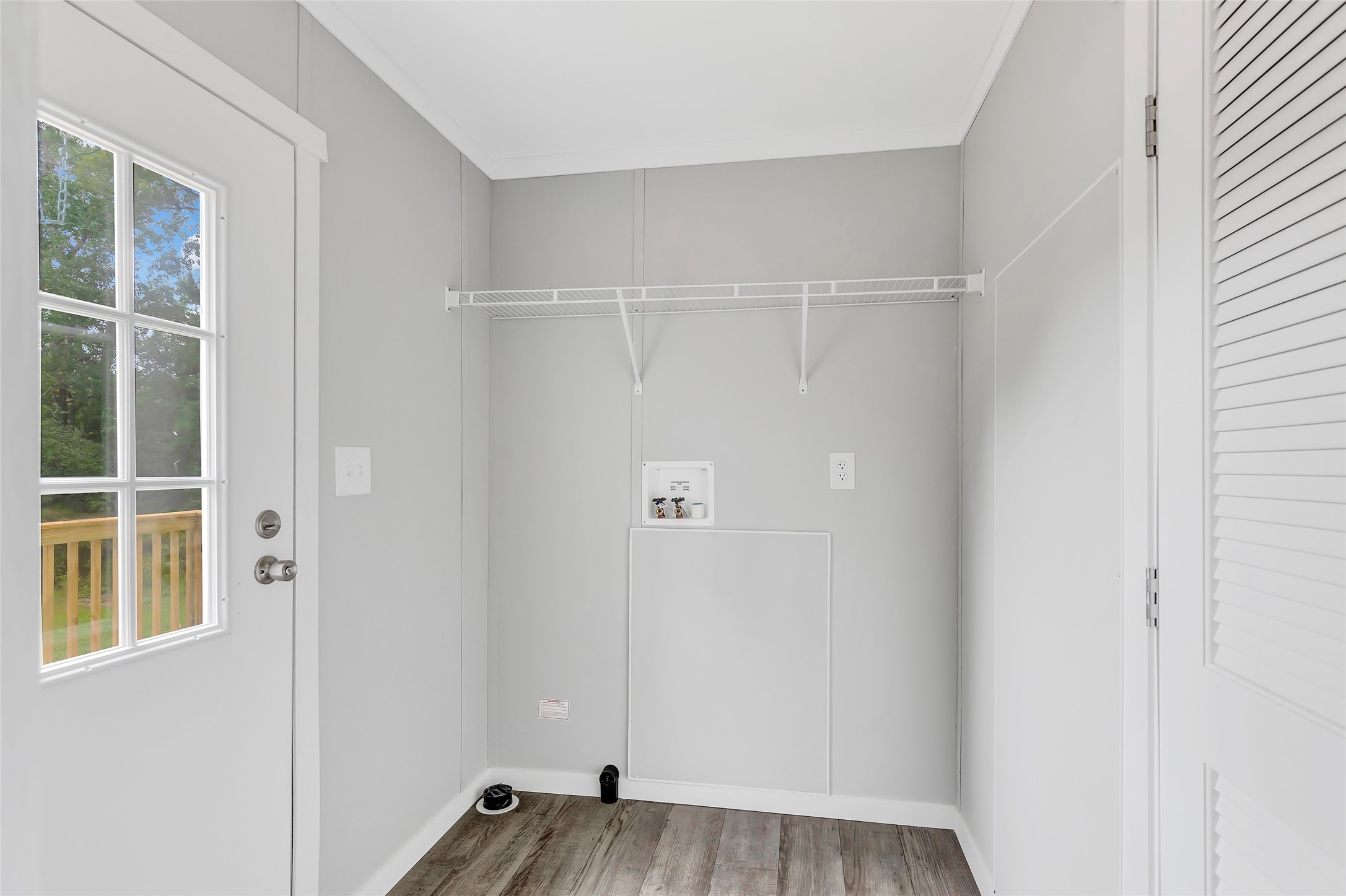 732 Lake Camelot Circle Ivanhoe, TX 75979 - Photo 14 of 18 a view of an empty room with wooden floor and a window