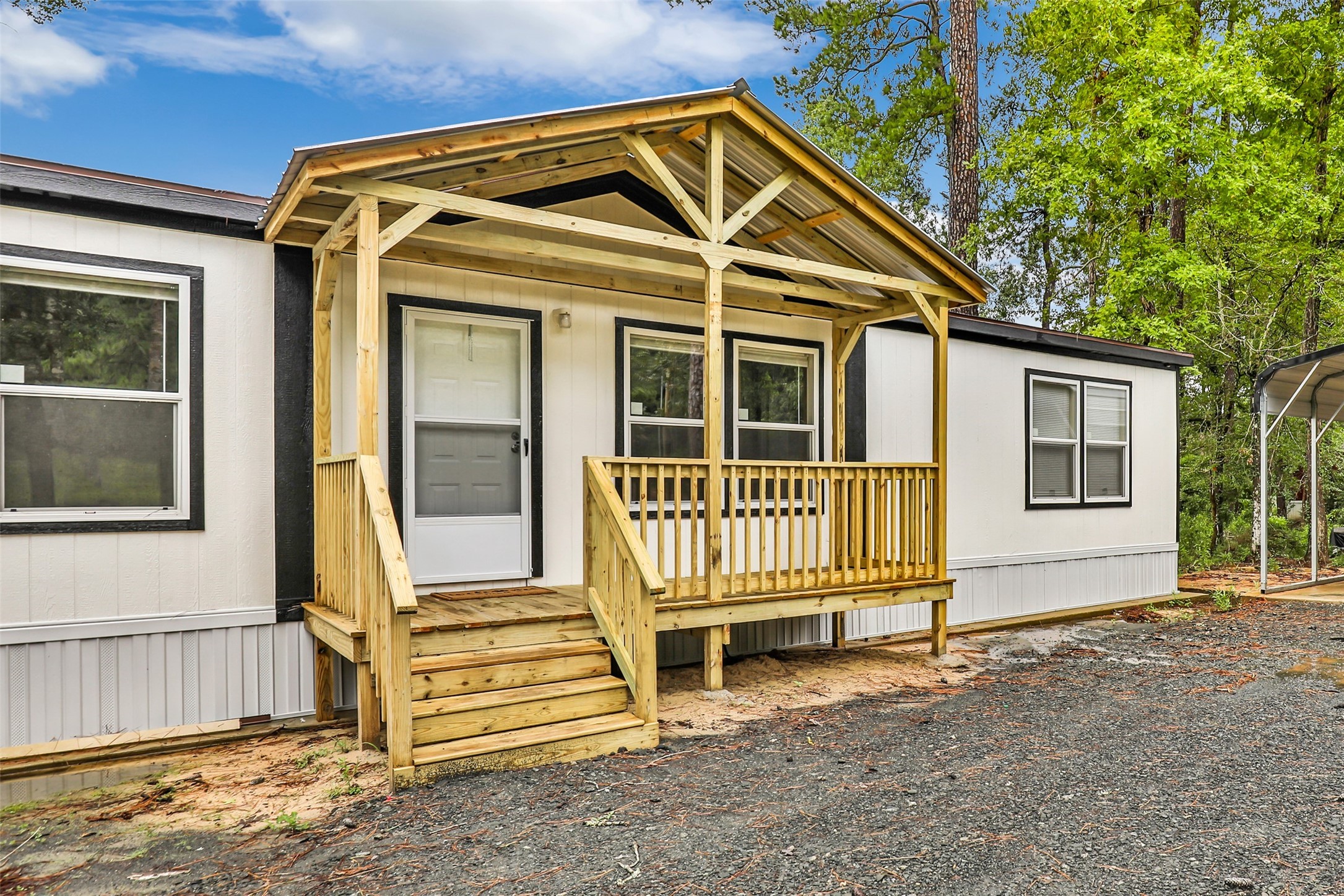 732 Lake Camelot Circle Ivanhoe, TX 75979 - Photo 2 of 18 a front view of a house with a porch