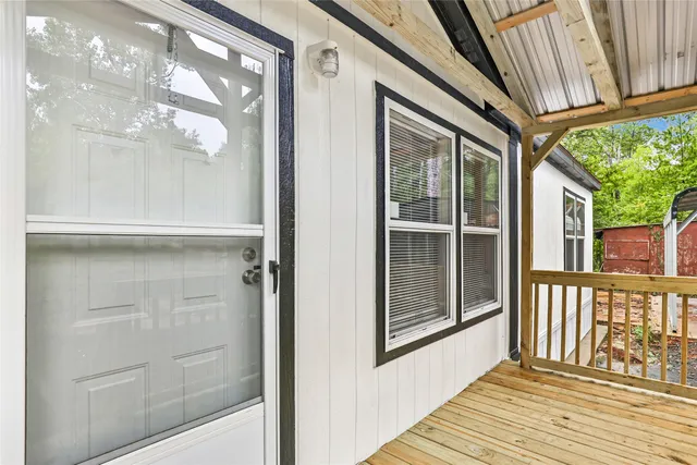 a view of a brick house with a large window