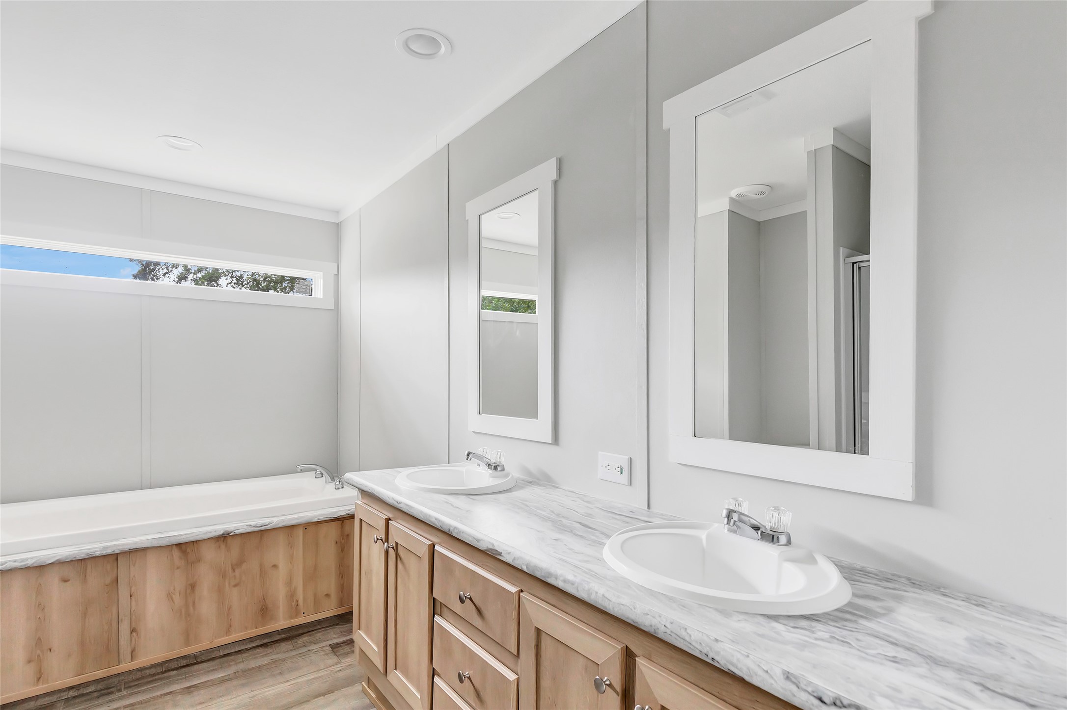 732 Lake Camelot Circle Ivanhoe, TX 75979 - Photo 9 of 18 a bathroom with a granite countertop sink and a mirror