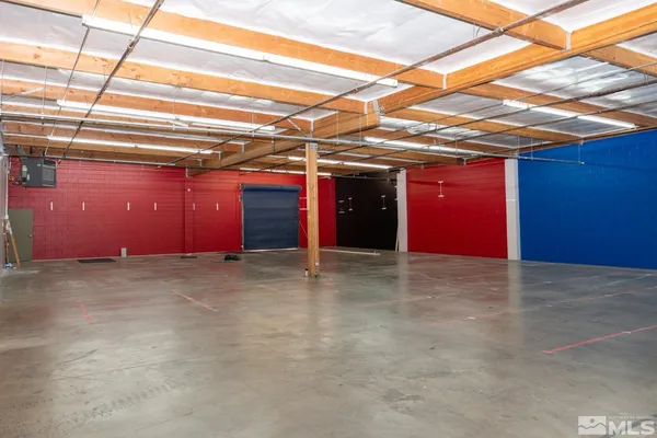 a view of a room with wooden walls