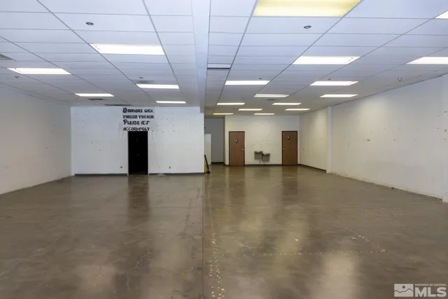 a view of a room with a kitchen
