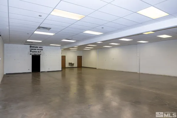 an empty room with a wooden floor