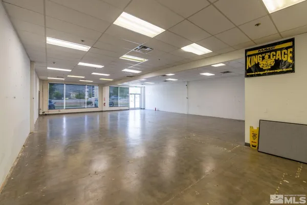 a view of a room with lots of wooden furniture