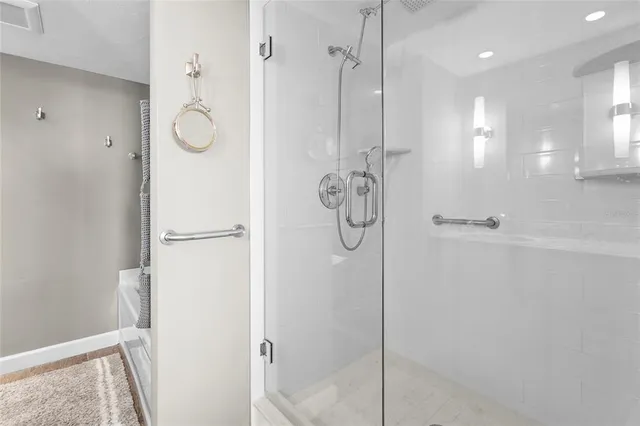 a en suite bathroom with a sink and a mirror