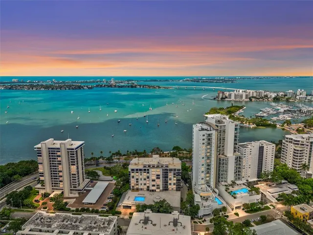 a swimming pool with outdoor seating and yard