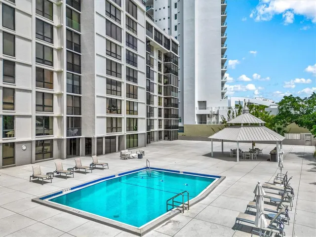 a living room with furniture ceiling fan and a rug