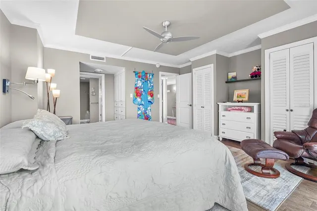 a en suite bathroom with a double vanity sink a mirror and a shower