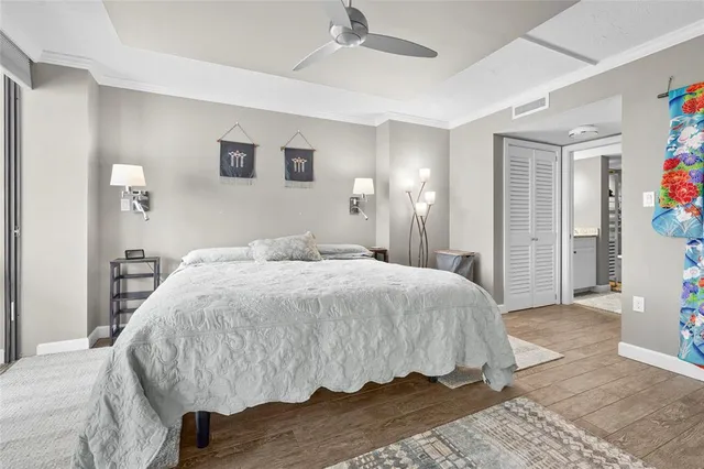 a en suite bathroom with a granite countertop sink and a mirror