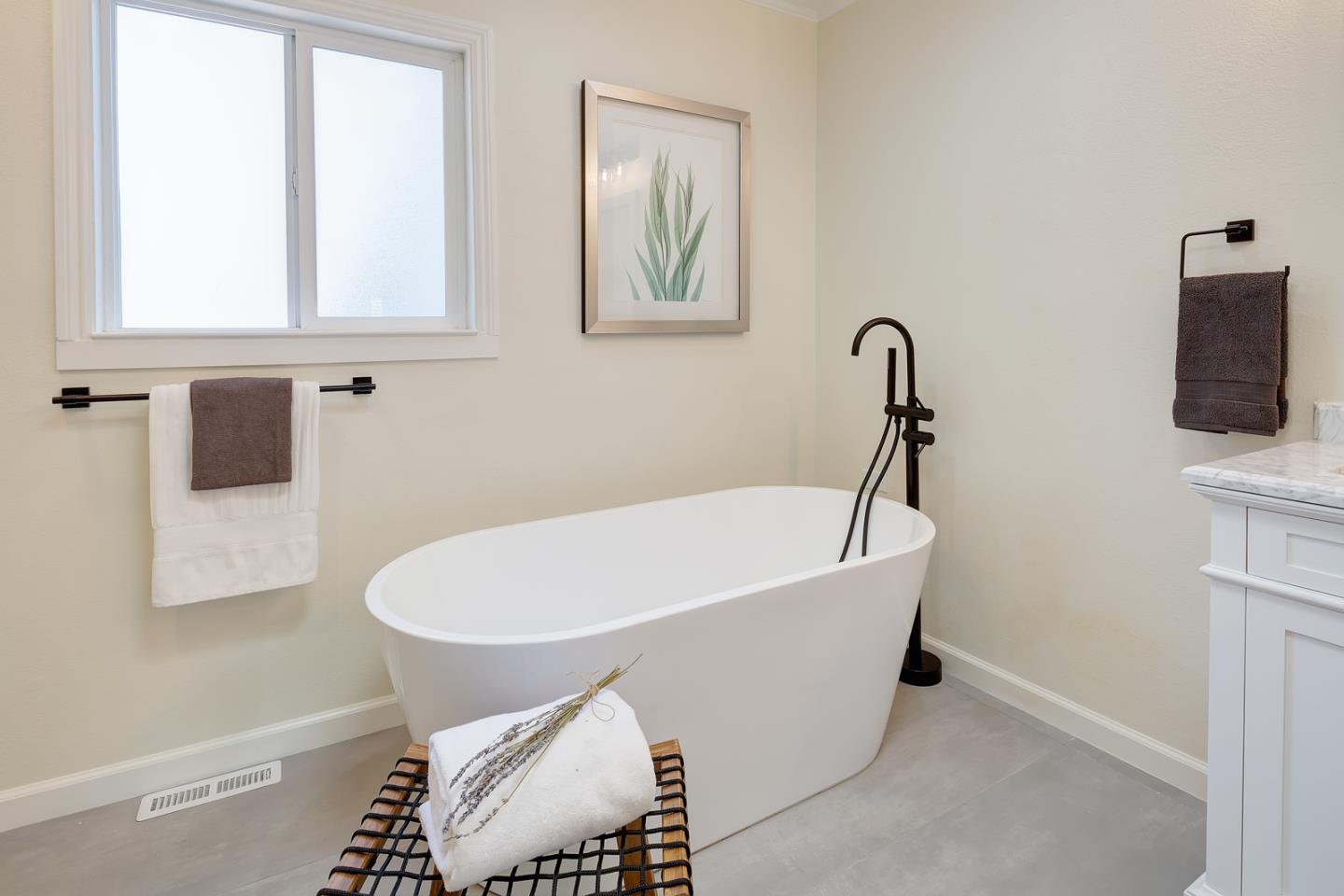 106 Springer Road Los Altos, CA 94024 - Photo 24 of 52 a bath tub sitting next to a white toilet and sink