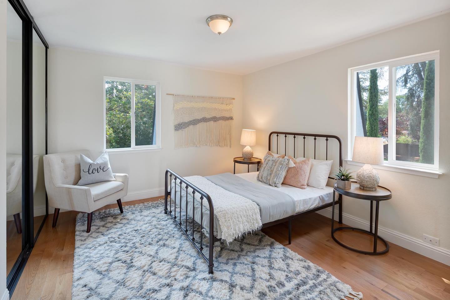 106 Springer Road Los Altos, CA 94024 - Photo 28 of 52 a bedroom with a bed a lamp and a large window