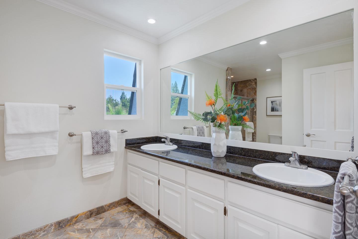 106 Springer Road Los Altos, CA 94024 - Photo 29 of 52 a bathroom with a granite countertop sink and a mirror