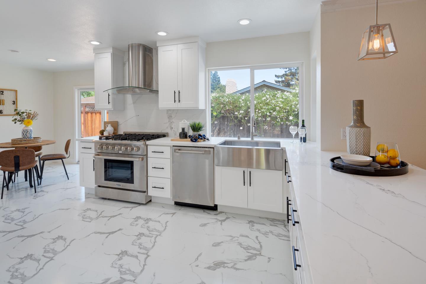 106 Springer Road Los Altos, CA 94024 - Photo 3 of 52 a kitchen with a stove a sink and a refrigerator