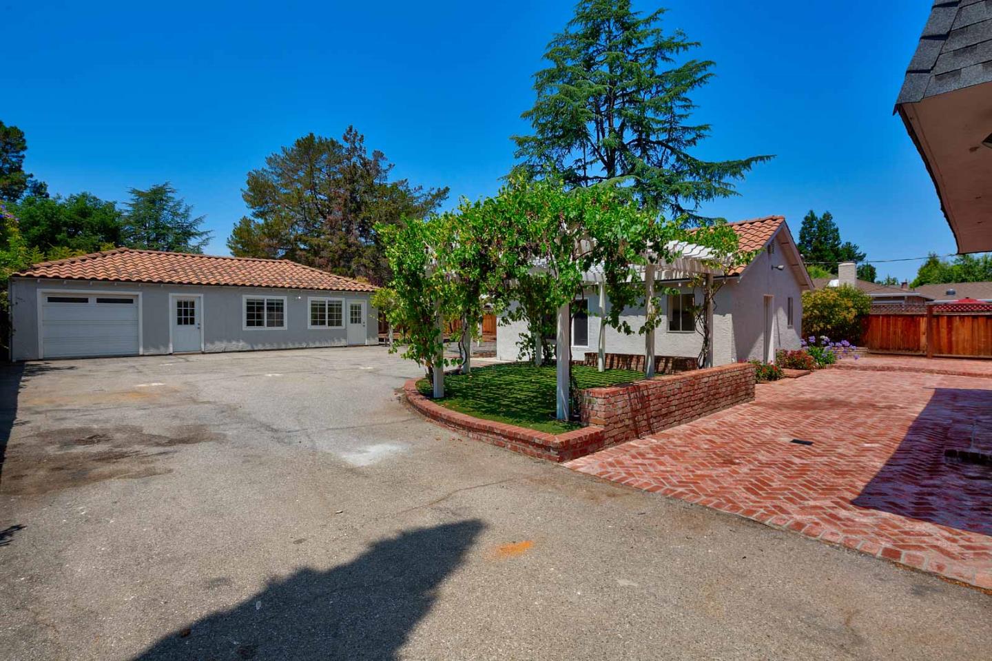 106 Springer Road Los Altos, CA 94024 - Photo 33 of 52 front view of house with a yard and potted plants