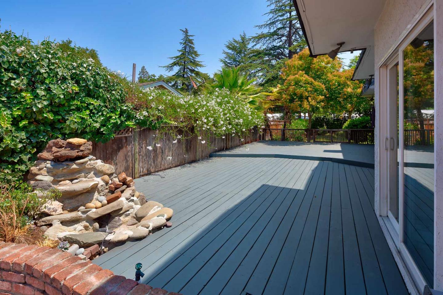 106 Springer Road Los Altos, CA 94024 - Photo 34 of 52 a backyard of a house with lots of green space