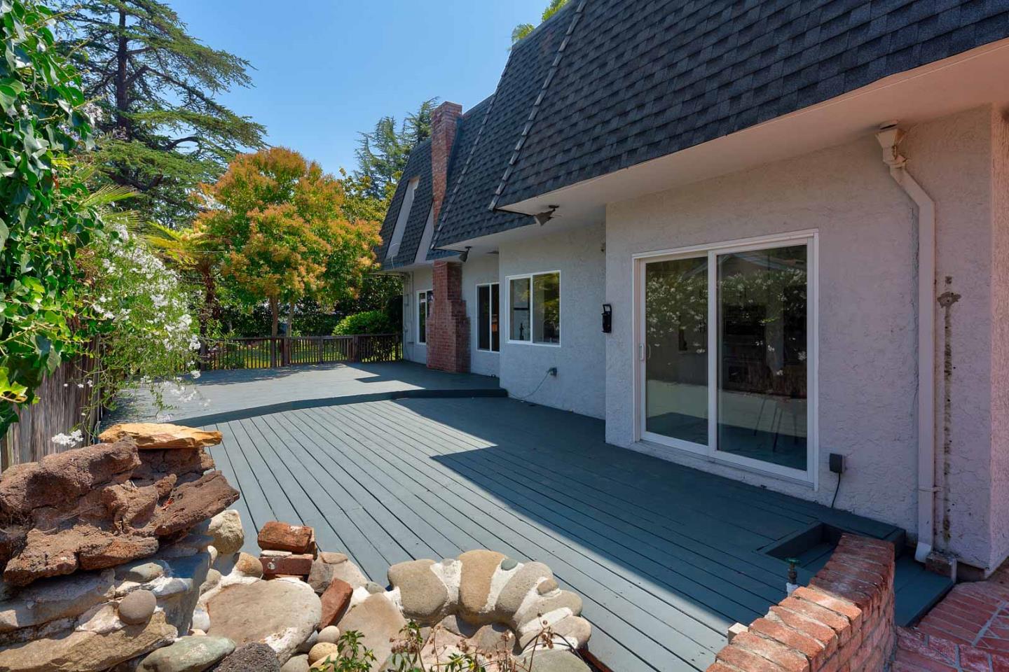 106 Springer Road Los Altos, CA 94024 - Photo 35 of 52 a view of backyard with wooden floor and a potted plant