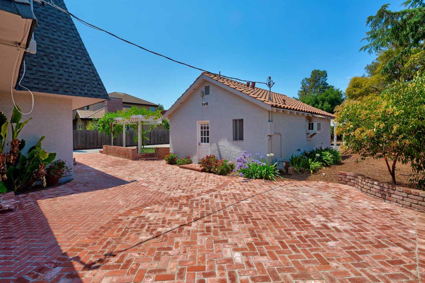 106 Springer Road Los Altos, CA 94024 - Photo 36 of 52 a front view of a house with garden