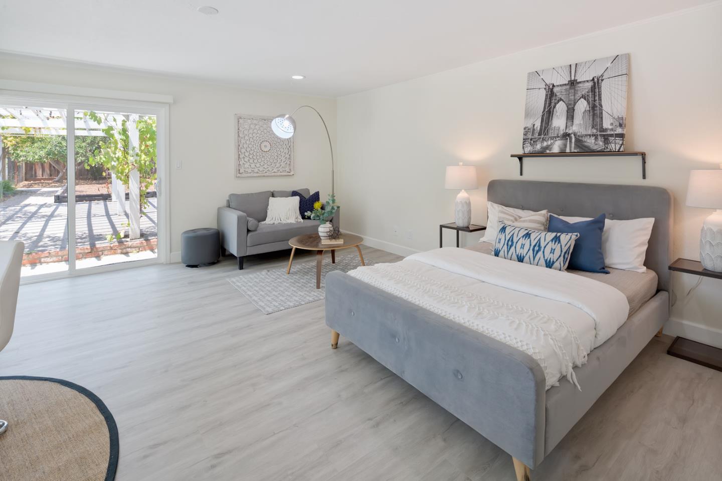 106 Springer Road Los Altos, CA 94024 - Photo 38 of 52 a bedroom with a bed and glass window