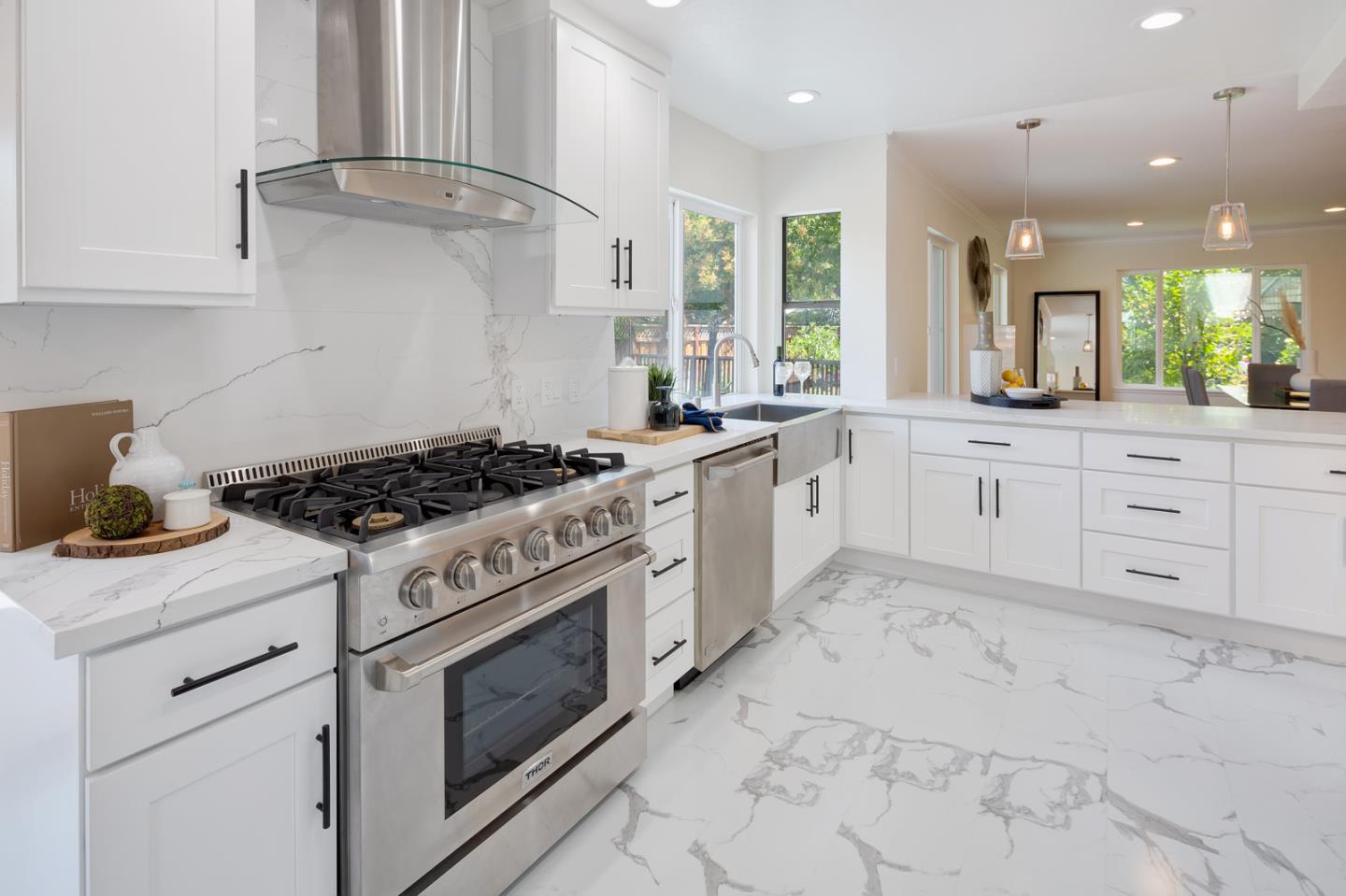 106 Springer Road Los Altos, CA 94024 - Photo 4 of 52 a kitchen with granite countertop a stove sink and cabinets