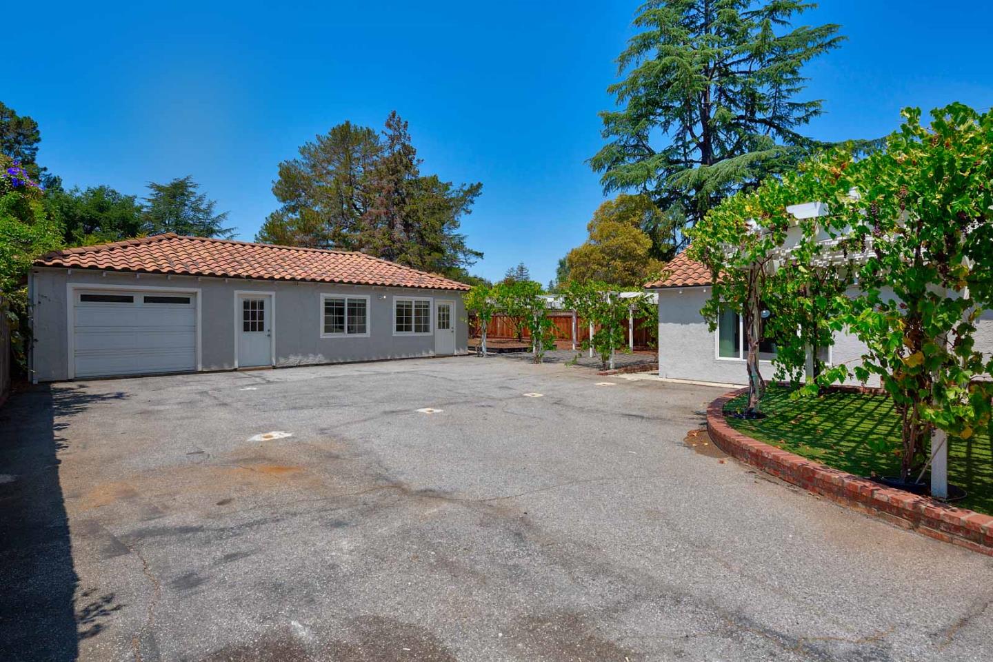 106 Springer Road Los Altos, CA 94024 - Photo 43 of 52 front view of a house with a street