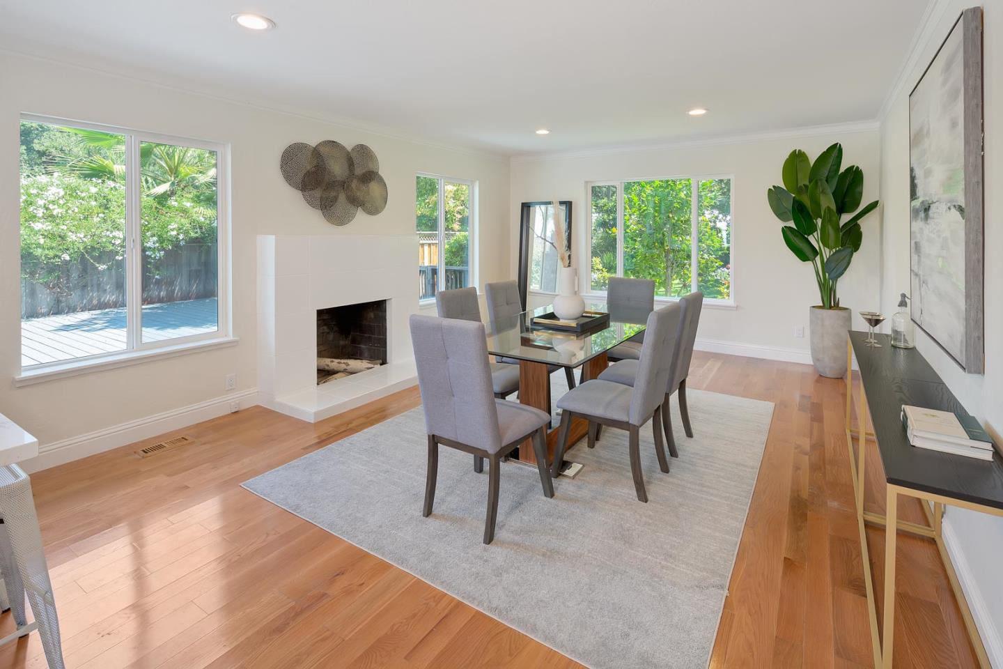 106 Springer Road Los Altos, CA 94024 - Photo 8 of 52 a dining room with furniture a fireplace and wooden floor