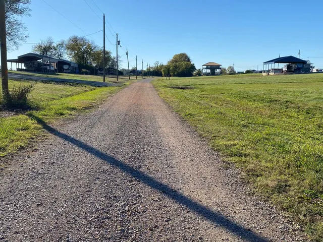 a view of a lake with a yard