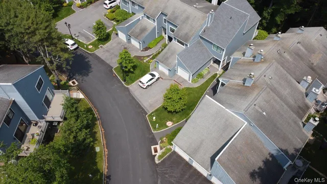 an aerial view of a house with outdoor space